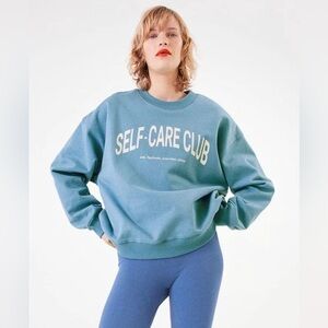 Self Care Club blue sweatshirt from H&M